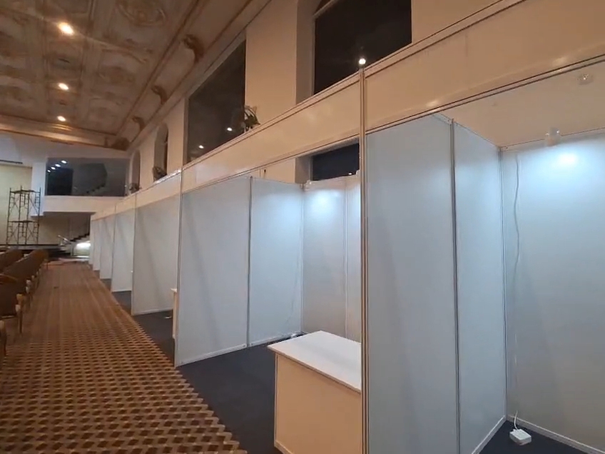 island exhibition stall with LED screen and hanging ring banner