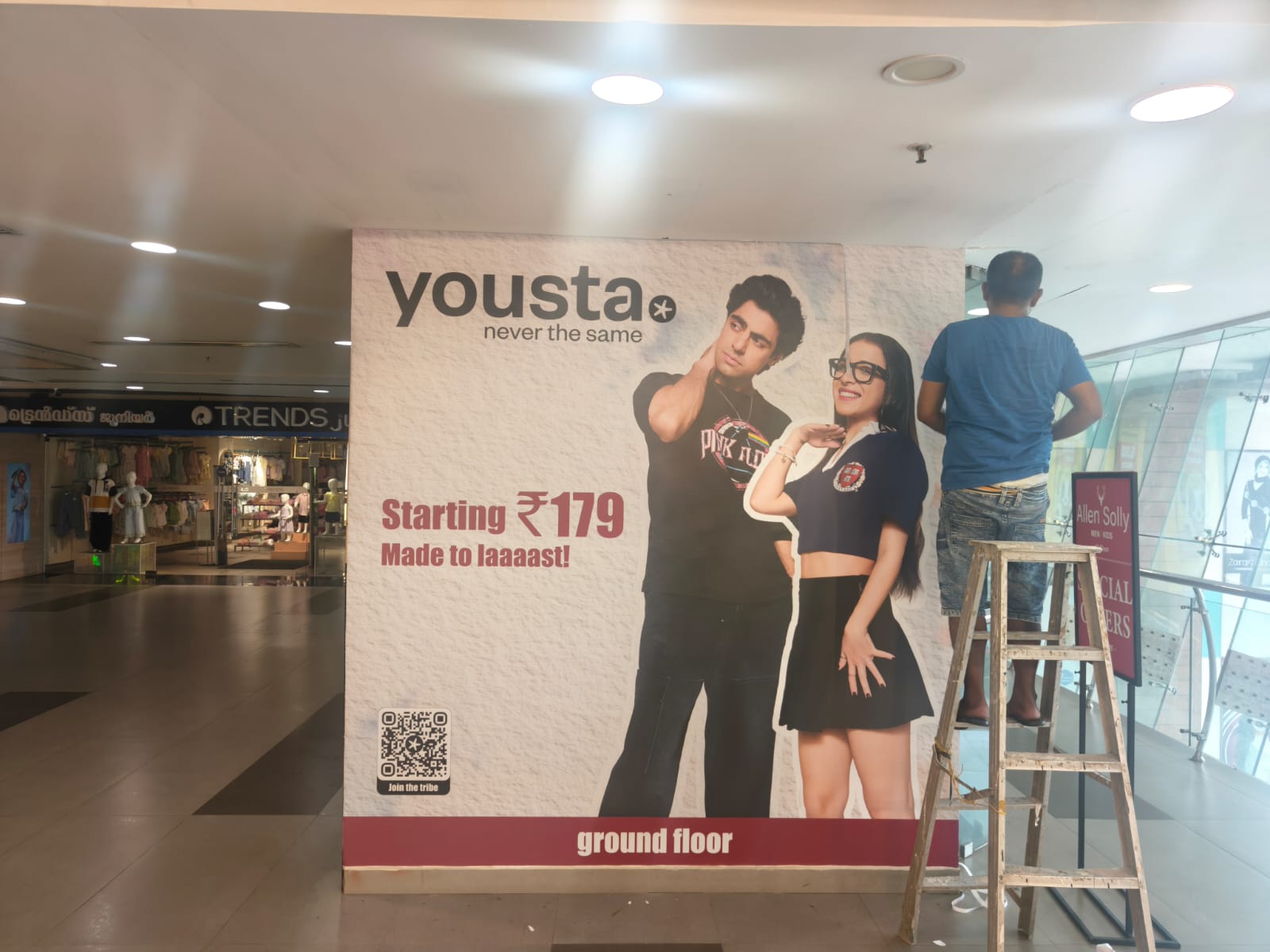mall atrium promotion with LED backdrop, hanging banner and promoters