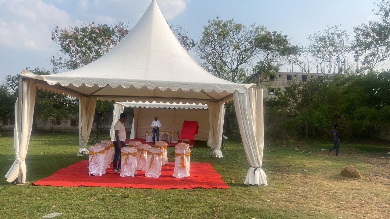 outdoor canopy promotion with flags, counter and promoters