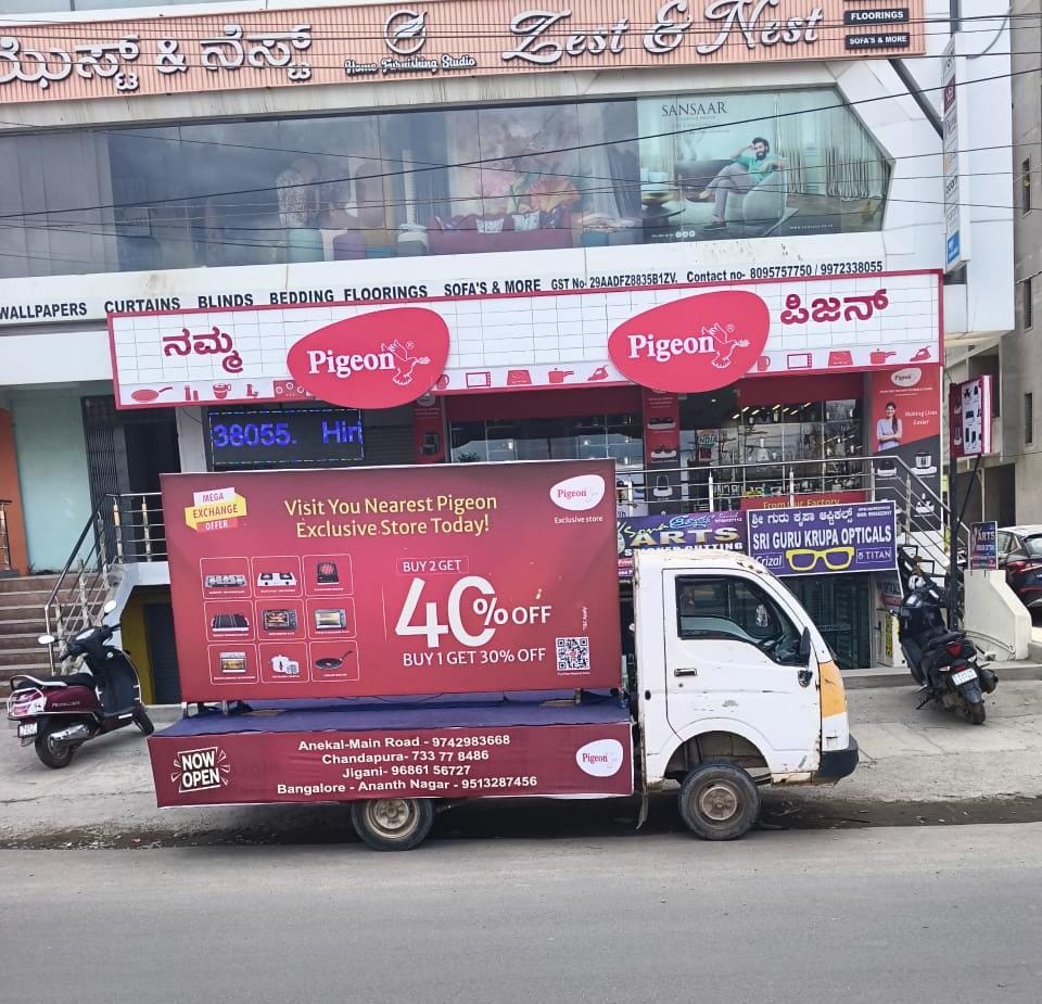 roadshow vehicle with LED side screen on a city route